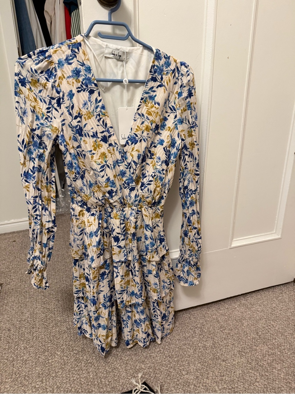 Floral V-Neck Ruffle Tiered Dress in white with blue and gold floral print.
